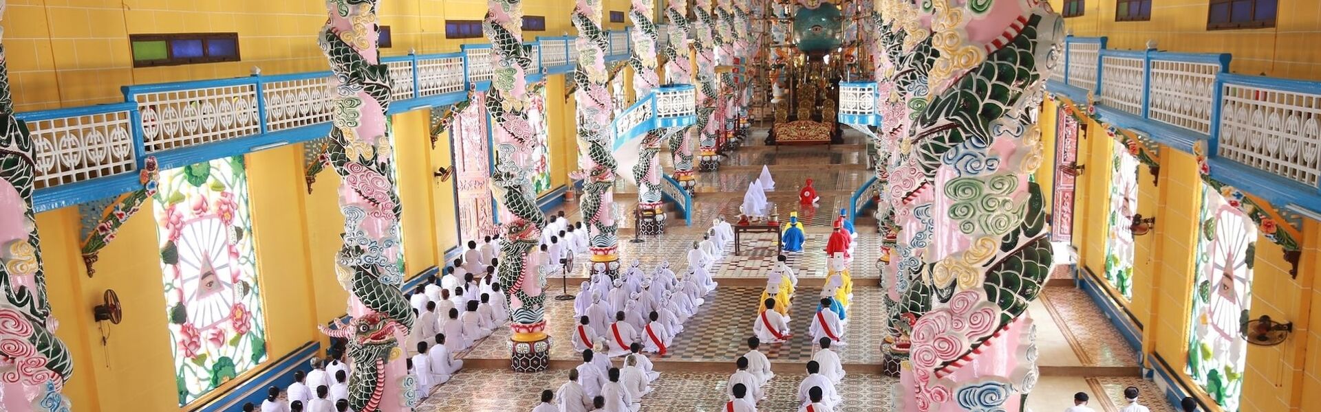Cultural ceremony at Cao Dai Holy See on a Cao Dai Travel tour by Legend Travel Group.